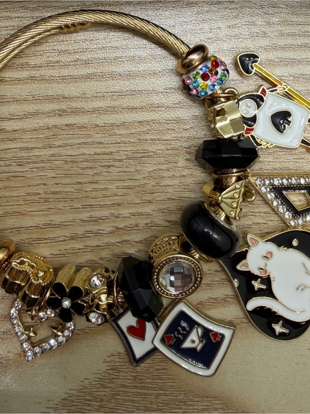 Gold Tone Women's Charm Bracelet with Black, White & Multicolor Accents